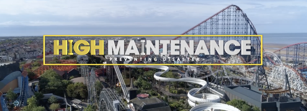 High Maintenance - Preventing Disaster. The background is showing a rollercoaster park next to the beach in a large city.